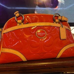 Gorgeous orange coach purse.